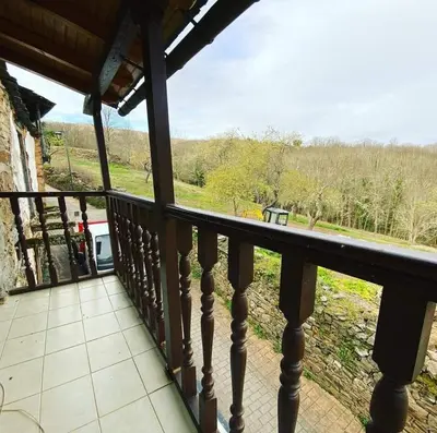 a balcony with a view of a field at Villa de Castro in Villar de los Barrios