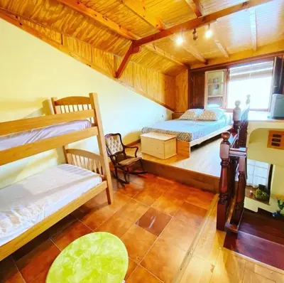 a bedroom with two bunk beds in a room at Villa de Castro in Villar de los Barrios