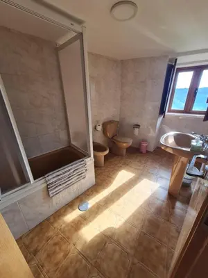 a bathroom with a shower and a toilet and a sink at Casa Fondo de Vila in Chantada