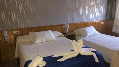 a room with two beds with stuffed animals on them at El Camino in Laza
