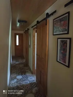an empty hallway of a house with a door and a hallway at CASA DA LOAIRA in Quiroga