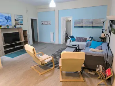a living room with a couch and a table and chairs at Tonos de Azul in Ponferrada