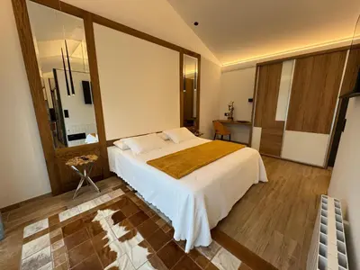 a bedroom with a large bed in a room at Puerto Franco in Jove