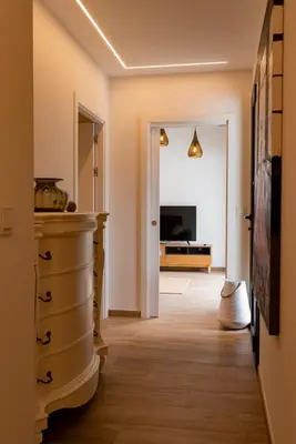 a hallway with a staircase leading to a living room at Aires De Míguez in Jove