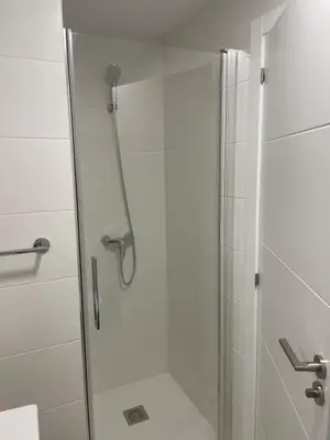 a bathroom with a shower with a glass door at Golden Views in Viveiro