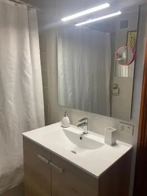 a bathroom with a sink and a mirror at Minâ in Taramundi