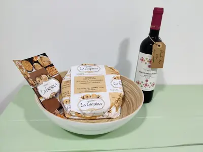 a bowl of cookies and a bottle of wine at La casa de Angel y Olimpia in Lugo