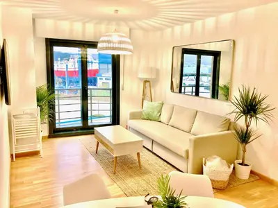 a living room with a couch and a table at The Cliffs - Sunset Village Beach 1C in Viveiro