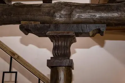 a wooden beam on a staircase in a museum at CASA PITAXAN in Melide
