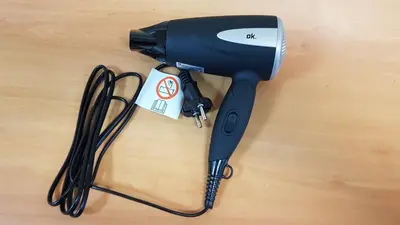 a hair dryer sitting on top of a wooden table at Apartamento Loft III Select Real Caldas de Reis in Caldas de Reis