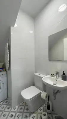 a bathroom with a sink and a mirror at Falda do Pedroso in Santiago de Compostela