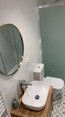 a bathroom with a white toilet and a mirror at Campo de Estrellas in Santiago de Compostela