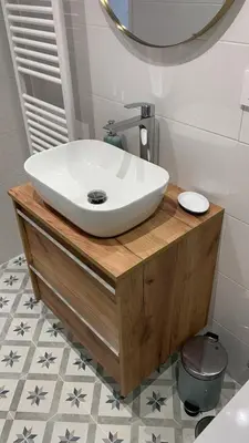 a bathroom with a white sink on a wooden counter at Campo de Estrellas in Santiago de Compostela