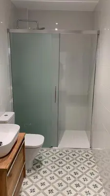 a bathroom with a shower with a toilet and a sink at Campo de Estrellas in Santiago de Compostela