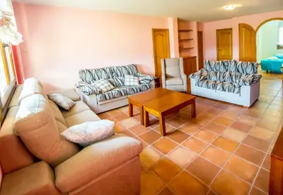a living room with two couches and a table at Welcome Villa Briallos in Portas