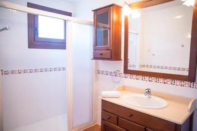 a bathroom with a sink and a shower at Welcome Villa Briallos in Portas
