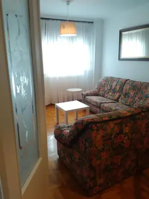 a living room with a couch and a table at APARTAMENTO RAFER in Ribadeo