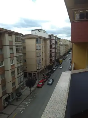 a view of a city street with parked cars at APARTAMENTO RAFER in Ribadeo