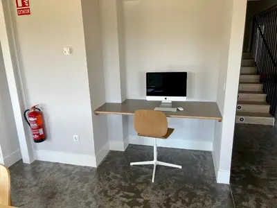 a computer sitting on a desk in a room at Casa Galego in Fonfría
