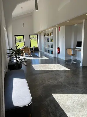 a living room with a couch and a desk at Casa Galego in Fonfría