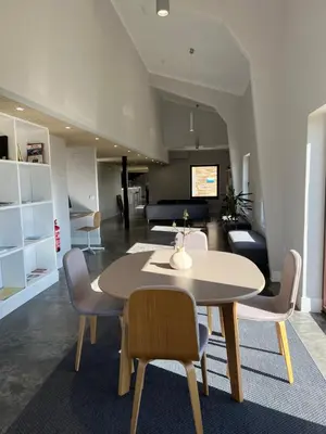 a living room with a table and chairs and a couch at Casa Galego in Fonfría
