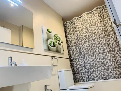 a bathroom with a shower with a sink and a mirror at Viveiro Centro in Viveiro