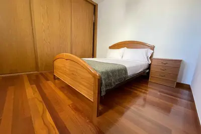a small bedroom with a bed and a dresser at Oktheway Calvo Sotelo in Sarria