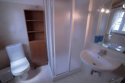 a bathroom with a shower and a toilet and a sink at Casa Morazón Fontán Sada in Sada