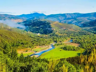 a valley with a river and mountains at Casa Honorio in Santa Marina del Sil