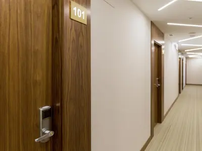 a door in a hallway with a sign on it at Hotel Condado Ourense in Ourense