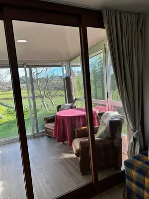 a building in the middle of a field with trees at Casa O Pazo - Rural - Camino Norte - Boimorto in Boimorto