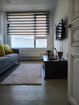 a living room with a couch and a window at O Chaleco in San Ciprián