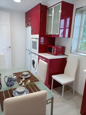 a living room with a couch and a tv at O Chaleco in San Ciprián