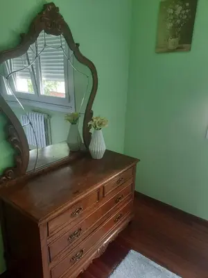 a mirror on top of a dresser in a room at Casa Lola in Teo