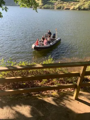 a group of people on a boat on a lake at Casa Escondida Aveiga in Chantada