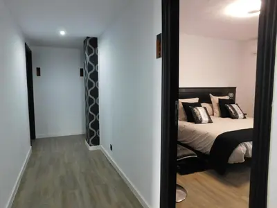 a bedroom with a bed and a mirror in a room at HOTEL TERRA GALEGA MEIGA in Monforte de Lemos