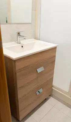 a bathroom with a sink and a mirror at Hostal Santa Cruz in Santiago de Compostela