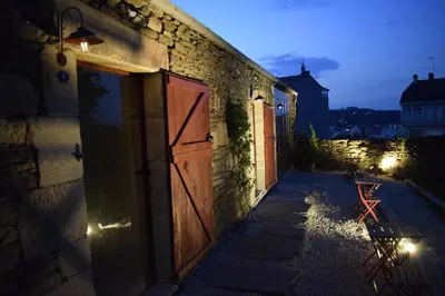 a door on the side of a building at night at CASA SOLANCE in Sarria
