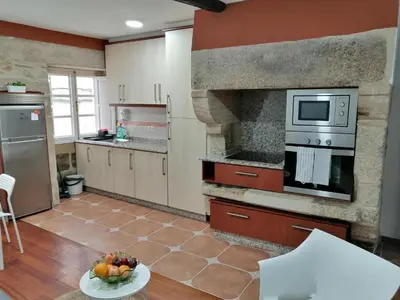 a kitchen with a sink and a stove top oven at SE@SE a 100m.Catedral. in Santiago de Compostela