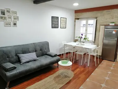 a living room with a couch and a table at SE@SE a 100m.Catedral. in Santiago de Compostela