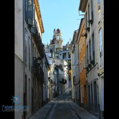 an empty alley with buildings on either side at Cabanela Maitia Apto Telmo Duplex in Ribadeo