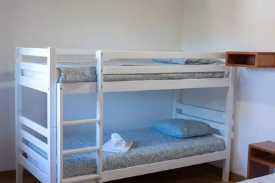a group of bunk beds in a room at CASA TERRA ALMA in Laza