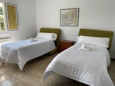 two beds sitting next to each other in a room at Fonte do Torno in A Coruña