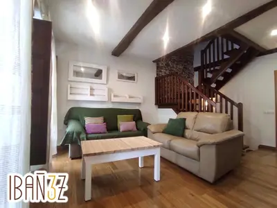 a living room with a couch and a table at Ibañez 3 in Ribadeo