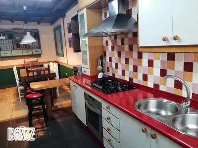 a kitchen with a sink and a stove at Ibañez 3 in Ribadeo