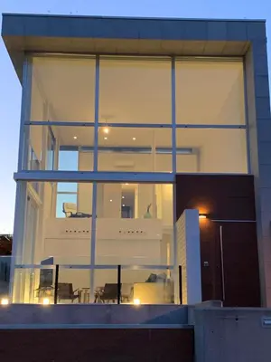 a large glass window of a house with a balcony at OKTHEWAY PERBES HOUSE in A Coruña