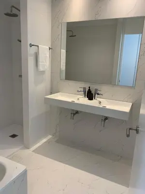 a white bathroom with a sink and a mirror at OKTHEWAY PERBES HOUSE in A Coruña