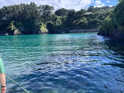 a person on a boat in a river at O Xuncal in Barreiros