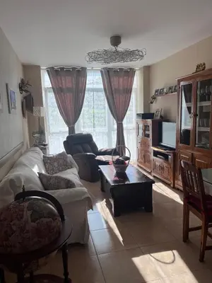 a living room with a couch and a table at O Xuncal in Barreiros
