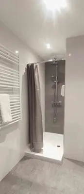 a bathroom with a shower with a shower curtain at Estación de Montaña Manzaneda, Ciudad de Lugo, 114 in Ourense